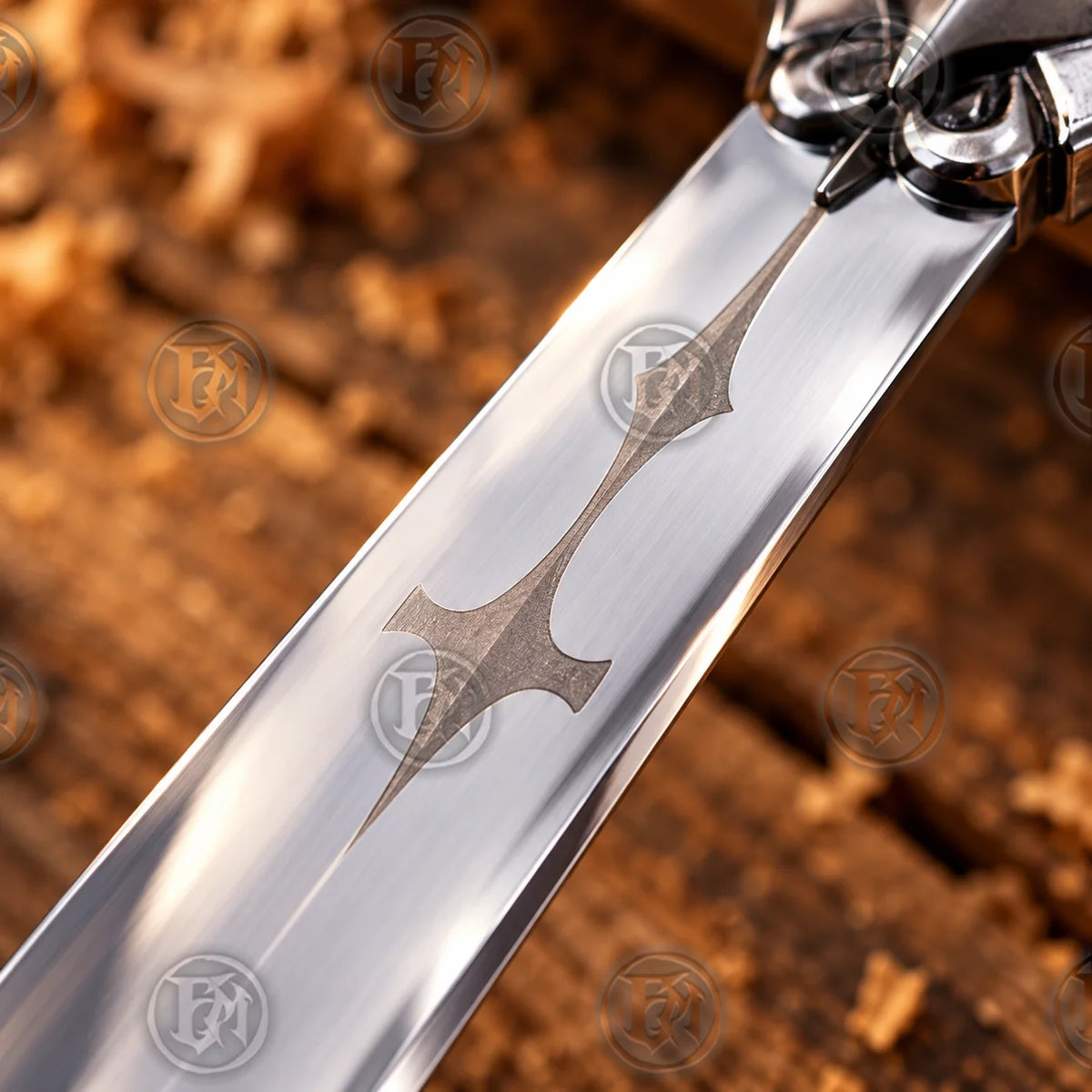 Close-up of Alucard stainless steel blade showing distinctive dark gothic decorative motif