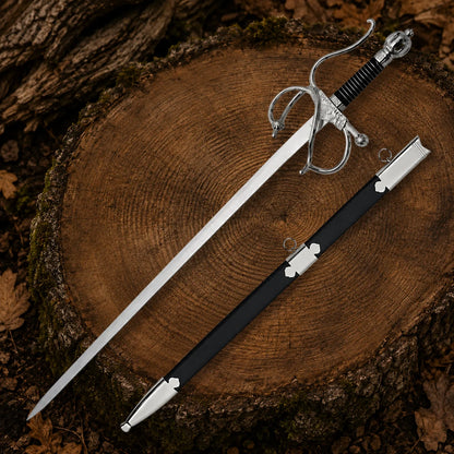 El Cid Rapier Sword and matching black faux leather scabbard displayed together on a large woodland tree stump