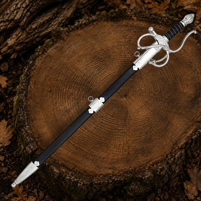 Full-length El Cid Rapier Sword with polished stainless steel blade, black grip and ornate silver guard displayed outdoors