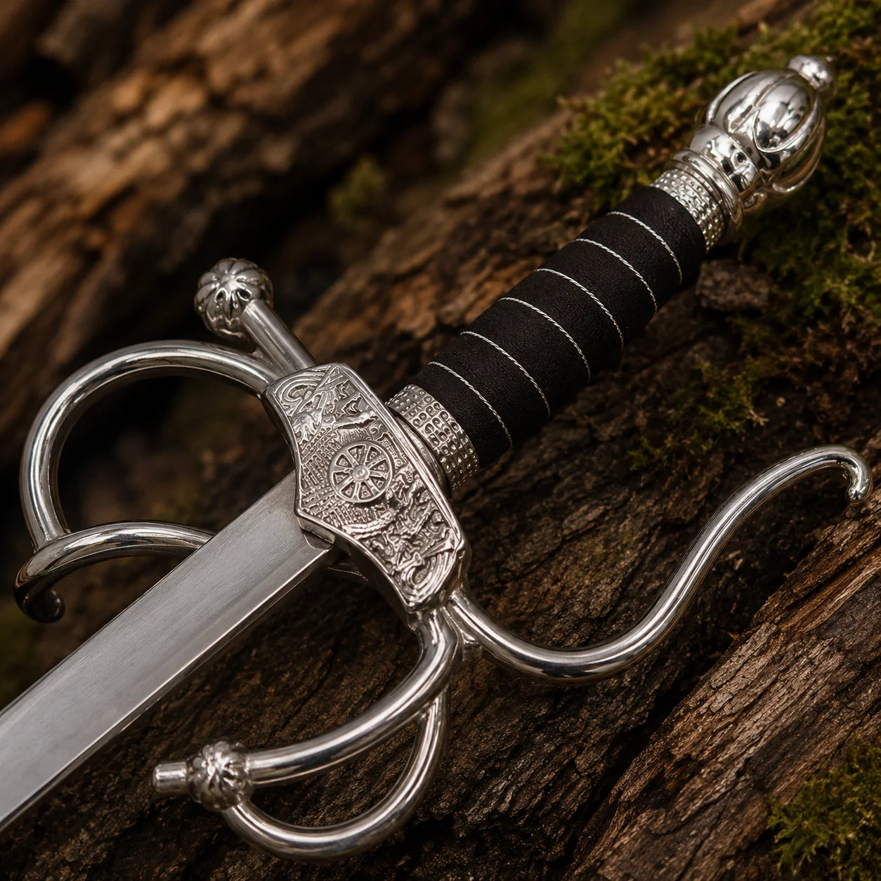 Close-up of the El Cid Rapier Sword handle featuring a black wrapped grip, silver pommel and detailed swept-hilt guard