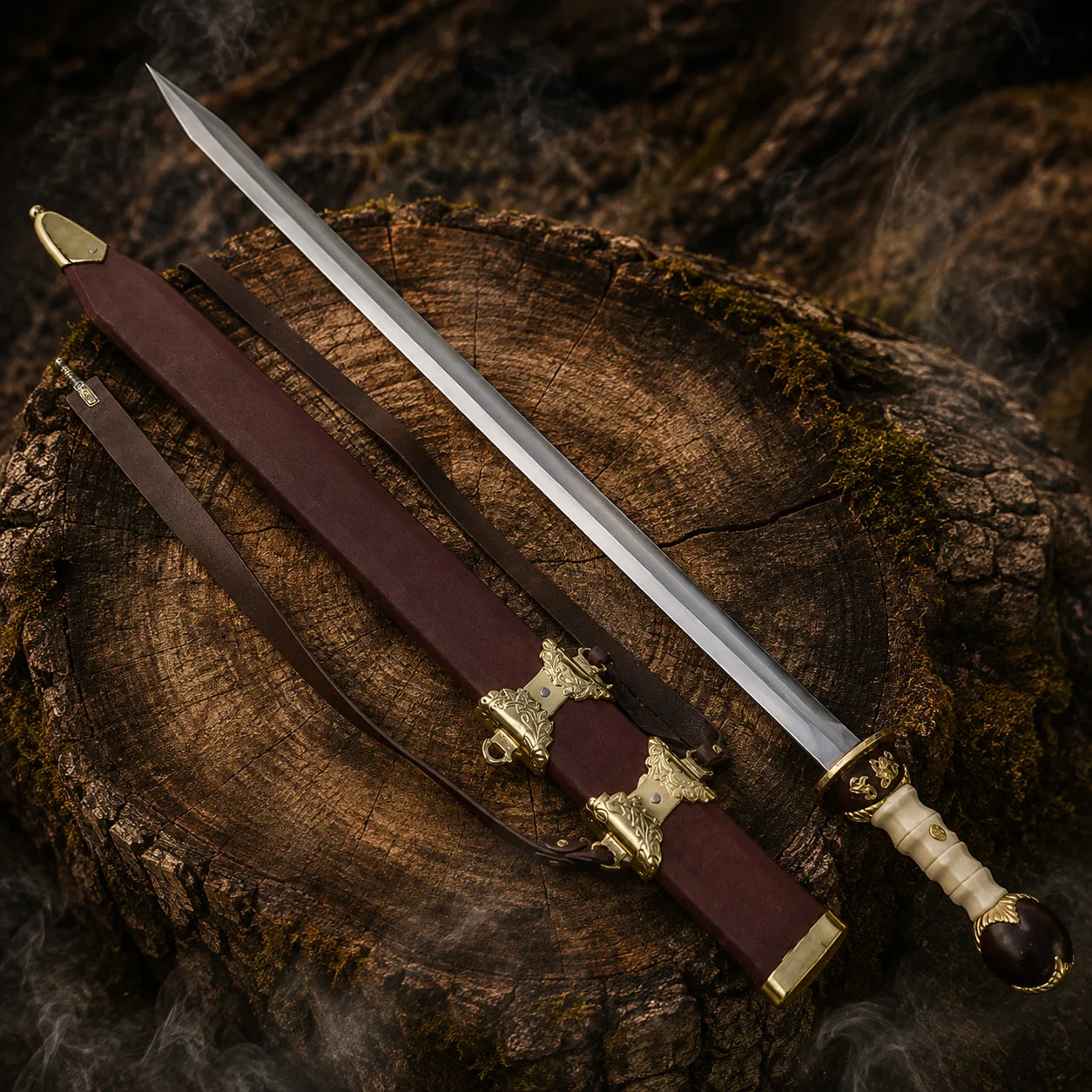 Gladiator Maximus gold finish collectible sword displayed beside its burgundy scabbard with ornate gold fittings and leather straps