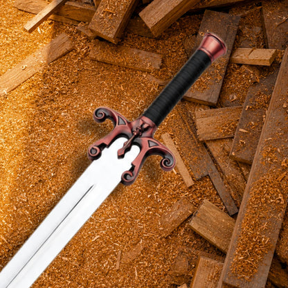 Close-up of He-Man Power Sword hilt showing reddish brass scrollwork skull guard, black wrapped grip and pommel