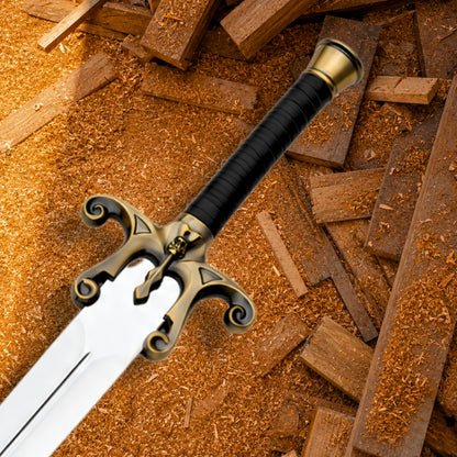 Close-up of He-Man Power Sword hilt with black wrapped grip, copper-tone scroll guard and central skull detail