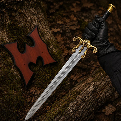 Gloved collector holding the He-Man Power Sword with ornate gold skull guard and polished silver blade in woodland