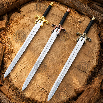 Overhead view of three Power Sword finishes on a cut tree stump highlighting gold, copper and antique brass guards