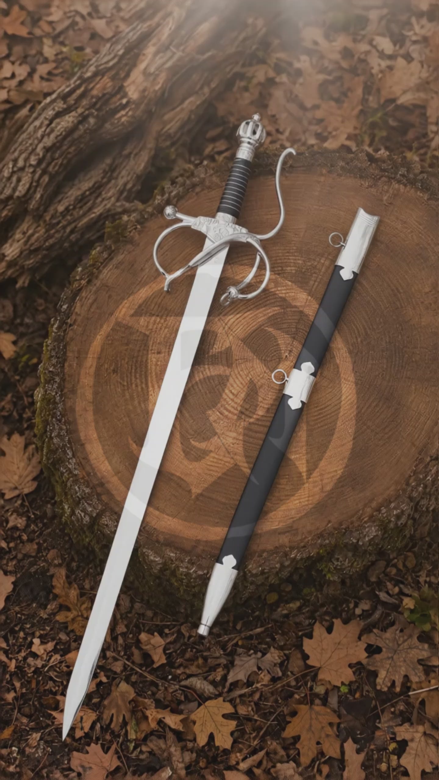 Cinematic vertical showcase of the El Cid rapier replica and black scabbard displayed on a woodland tree stump, highlighting the polished blade, wrapped grip and ornate swept-hilt design.