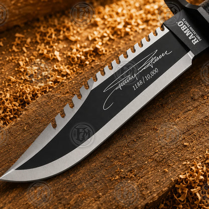 Close-up of matte-black Rambo Part II blade with sawback spine, signature graphic and 1188/10,000 numbering.